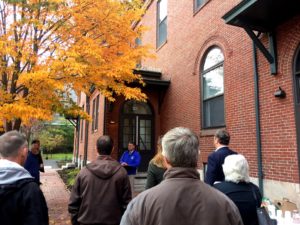 people gather at the Rosa True opening event on October 25